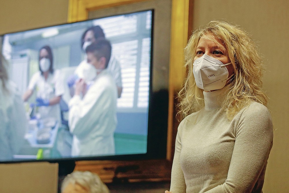 FILE - in this Sunday, Dec. 27, 2020 file photo, Dr. Annalisa Malara meets the media in Codogno, the northern Italian town that recorded Italy's first locally spread coronavirus infection. Italy delivered the first shocking confirmation of locally transmitted coronavirus infections outside of Asia a year ago Sunday, with back-to-back revelations of cases more than 150 kilometers (nearly 100 miles) apart in the country's north. First, a 38-year-old man in Codogno, an industrial town in the Lombardy region, tested positive for COVID-19, sending panicked residents to pick up their children from school, stock up on provisions at grocery stores and search in vain for surgical masks at pharmacies. (AP Photo/Luca Bruno, File)