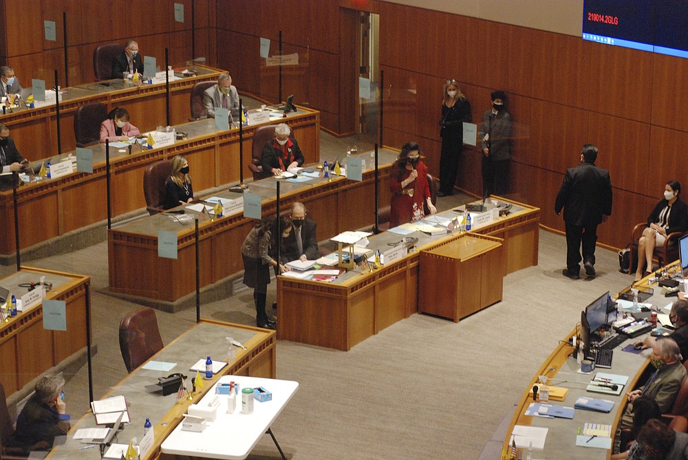 Democratic state Sen. Linda Lopez of Albuquerque, standing with a microphone, leads an effort to shore up abortion rights in New Mexico at the Statehouse in Santa Fe, N.M., Thursday, Feb. 11, 2021. Female senators took the lead in presenting the Democratic-sponsored bill that would repeal a 1969 ban on most abortion procedures. The law has been dormant since 1973 when the nation's highest court issued the Roe v. Wade decision, overriding state laws that banned or severely restricted access to abortion procedures. (AP Photo/Morgan Lee)