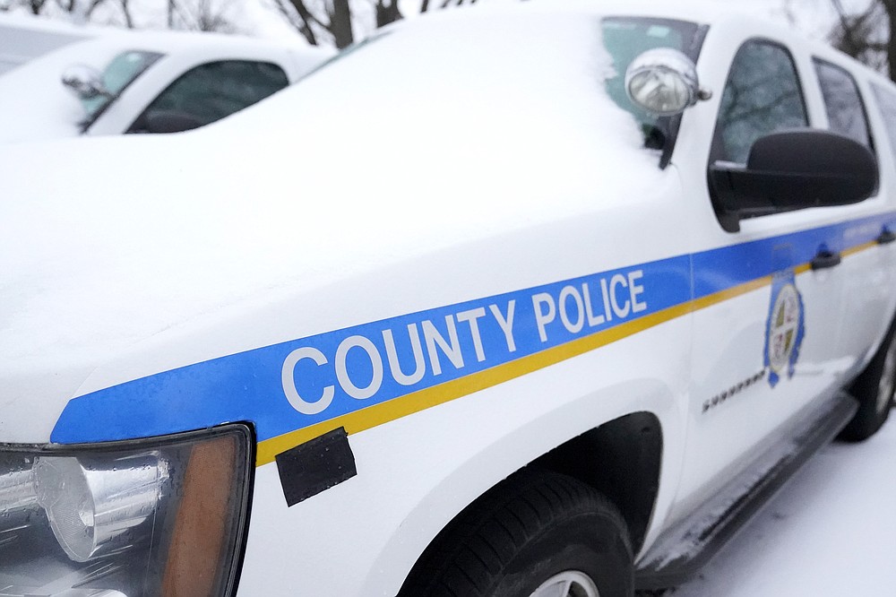 A Baltimore County police SUV is seen covered with snow while parked in a lot, Thursday, Feb. 18, 2021, in Hunt Valley, Md. A package of police reforms in Maryland this year prompted by the death of George Floyd includes a proposed repeal of the Law Enforcement Officers Bill of Rights, the first-in-the-nation law implemented in 1974 that has been replicated in other states. (AP Photo/Julio Cortez)