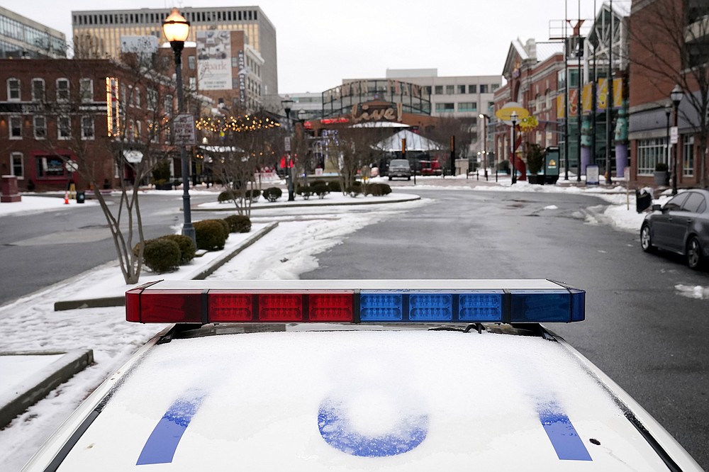 A Baltimore police cruiser is seen parked, Thursday, Feb. 18, 2021, in Baltimore. A package of police reforms in Maryland this year prompted by the death of George Floyd includes a proposed repeal of the Law Enforcement Officers Bill of Rights, the first-in-the-nation law implemented in 1974 that has been replicated in other states. (AP Photo/Julio Cortez)