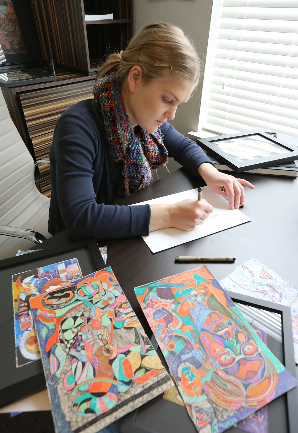 Visual artist Hannah Jeremiah continues to draw Wednesday, February 17, 2021, in her apartment in Fayetteville. Jeremiah is attending the first Artist INC Express workshop held in Arkansas. Artist INC has to date only been offered in NWA for Arkansas through the M-AAA. The program helps participants develop business skills as working artists. Check out nwaonline.com/210218Daily/ and nwadg.com/photos for a photo gallery.
(NWA Democrat-Gazette/David Gottschalk)