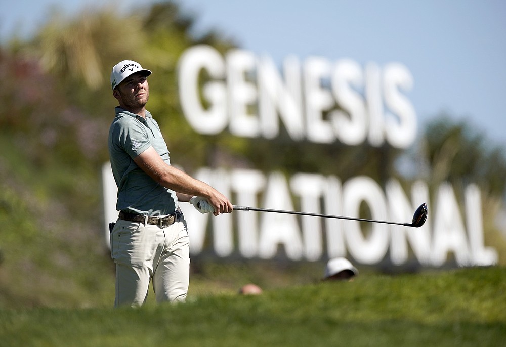 Sam Burns watches his tee shot on the third hole during the final round of the Genesis Invitational golf tournament at Riviera Country Club, Sunday, Feb. 21, 2021, in the Pacific Palisades area of Los Angeles. (AP Photo/Ryan Kang)