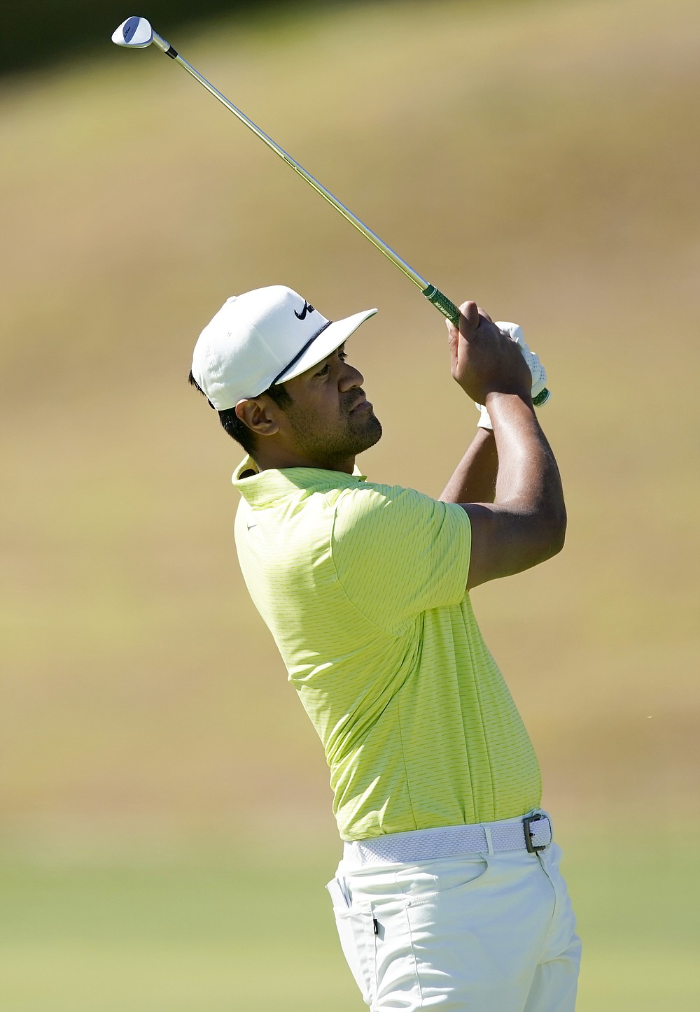 Tony Finau watches his second shot on the ninth hole during the final round of the Genesis Invitational golf tournament at Riviera Country Club, Sunday, Feb. 21, 2021, in the Pacific Palisades area of Los Angeles. (AP Photo/Ryan Kang)