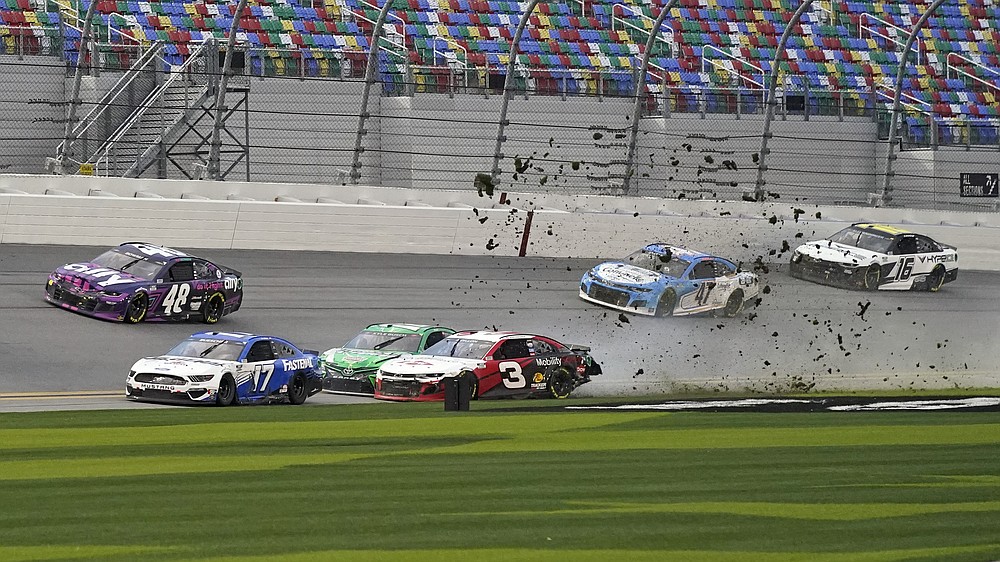 Austin Dillon (3) and Kyle Busch, center left, crash heading down the front stretch as Chris Buescher (17), Alex Bowman (48), Ricky Stenhouse Jr. (47) and AJ Allmendinger (16) make moves to avoid the crash during NASCAR Cup Series road course auto race at Daytona International Speedway, Sunday, Feb. 21, 2021, in Daytona Beach, Fla. (AP Photo/John Raoux)
