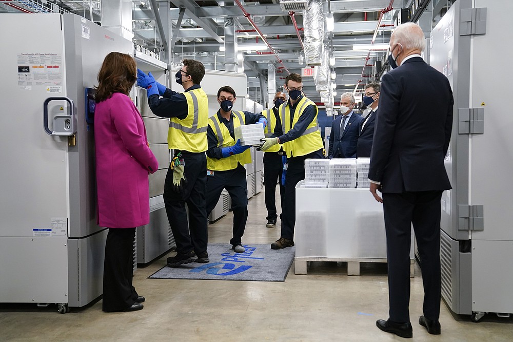 FILE - In this Feb. 19, 2021, file photo President Joe Biden, right, and Michigan Gov. Gretchen Whitmer, left, tour a Pfizer manufacturing site in Portage, Mich. (AP Photo/Evan Vucci, File)