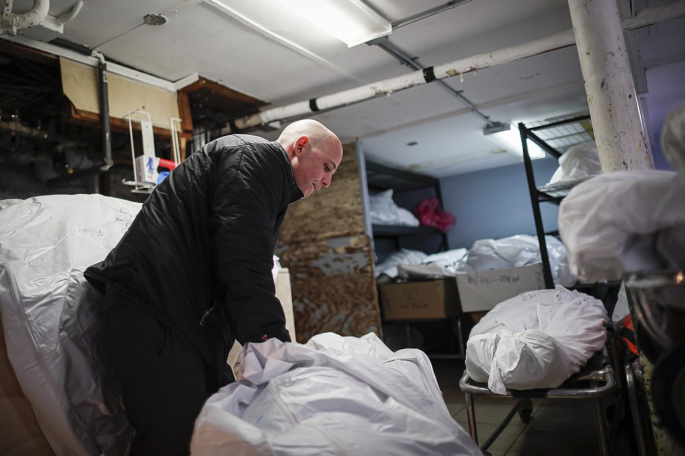 The Associated Press
In this April 2, 2020, file photo, Pat Marmo, owner of Daniel J. Schaefer Funeral Home, walks through his body holding facility in the Brooklyn borough of New York. The U.S. death toll from COVID-19 has topped 500,000 — a number so staggering that a top health researchers says it is hard to imagine an American who hasn't lost a relative or doesn't know someone who died.