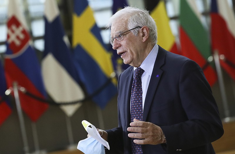 European Union foreign policy chief Josep Borrell speaks to the media as he arrives for a meeting of EU foreign ministers at the European Council building in Brussels, Monday, Feb 22, 2021. European Union foreign ministers on Monday will look at options for imposing fresh sanctions against Russia over the jailing of opposition leader Alexei Navalny as the 27-nation bloc considers the future of its troubled ties with the country. (Yves Herman, Pool via AP)