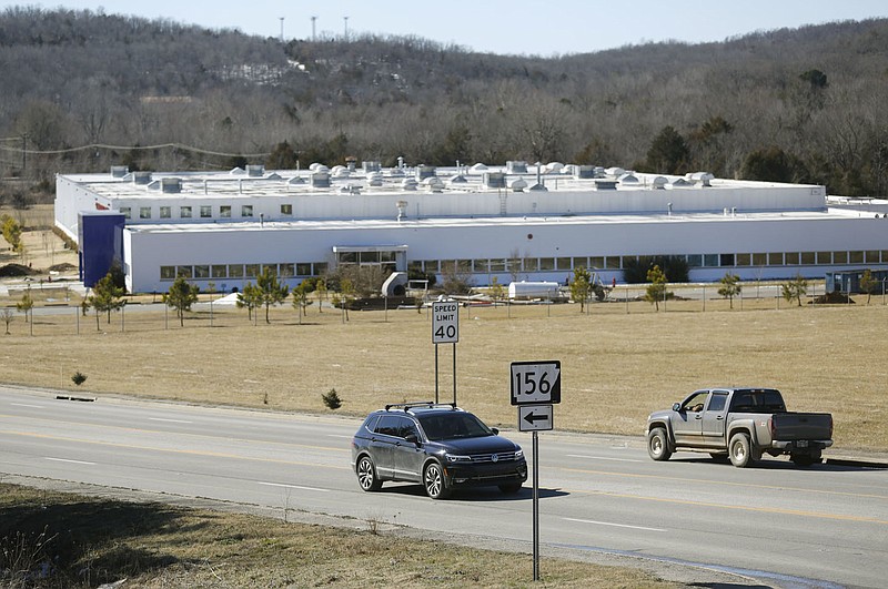 Traffic passes by the former Standard Register Co. building Monday, February 22, 2021, located at 3655 S. School Ave. in Fayetteville. Plans are in the works to turn the building into a 99,000-square-foot warehouse with a nearly 40,000-square-foot office and showroom. Check out nwaonline.com/210223Daily/ and nwadg.com/photos for a photo gallery.
(NWA Democrat-Gazette/David Gottschalk)