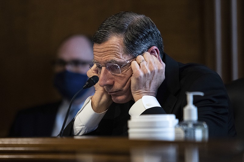 Senator John Barrasso, R-WY,  listens to Rep. Deb Haaland, D-N.M., during a confirmation hearing before the Senate Committee on Energy and Natural Resources hearing on her nomination to be Interior Secretary, Tuesday, Feb. 23, 2021 on Capitol Hill in Washington. (Graeme Jennings/Pool via AP)