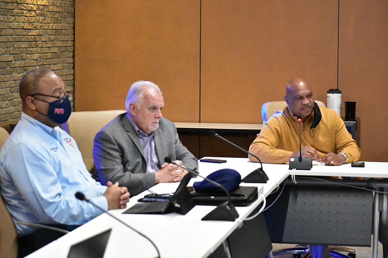 Pine Bluff Fire Chief Shauwn Howell (left), JRMC facilities director Danny Holcomb (center) and Jefferson County Judge Gerald Robinson listen to Liberty Utilities officials talk about the city's water problems on Tuesday. (Pine Bluff Commercial/I.C. Murrell)
