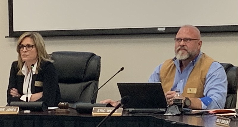 Debbie Jones, superintendent, and Eric White, school board president, listen to information on blended and virtual learning Tuesday at a Bentonville Schools work session. (NWA Democrat-Gazette/Mary Jordan)