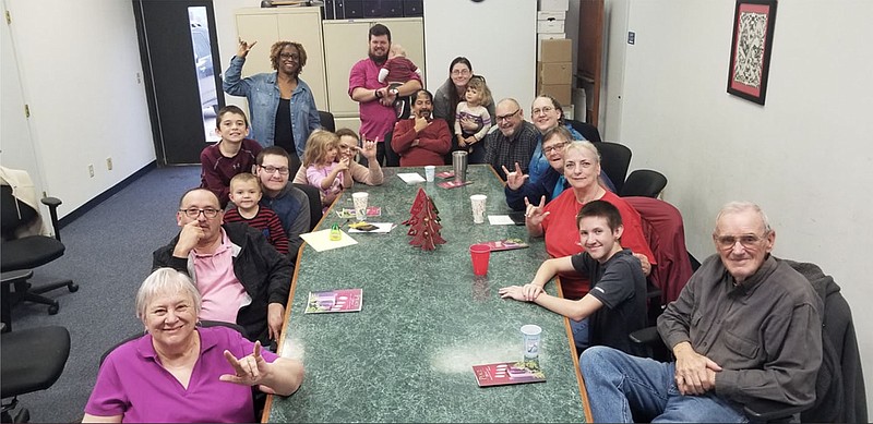 Members of Bethel Deaf Fellowship meet around a table in 2019. The congregation has 44 members, and attendance at in-person services was around 20-25 people.
(Special to the Democrat-Gazette/Bethel Deaf Fellowship)