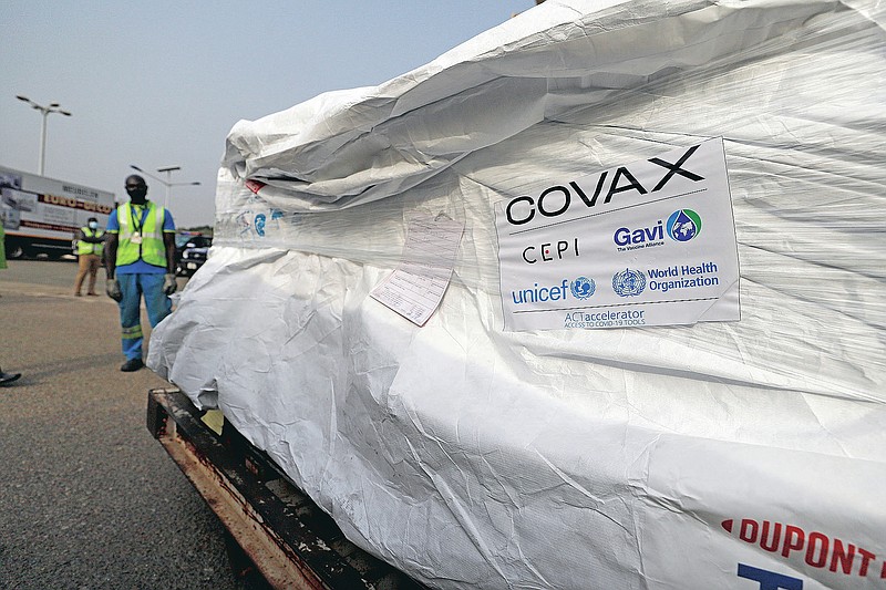 This photograph released by UNICEF on Wednesday Feb. 24, 2021 shows the first shipment of COVID-19 vaccines distributed by the COVAX Facility arriving at the Kotoka International Airport in Accra, Ghana. Ghana has become the first country in the world to receive vaccines acquired through the United Nations-backed COVAX initiative with a delivery of 600,000 doses of the AstraZeneca vaccine made by the Serum Institute of India. (Francis Kokoroko/UNICEF via AP)