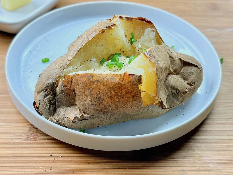 Jacket potato, a baked potato prepared using an English method, has a crackly crisp skin and tender, fluffy flesh. (Arkansas Democrat-Gazette/Kelly Brant)