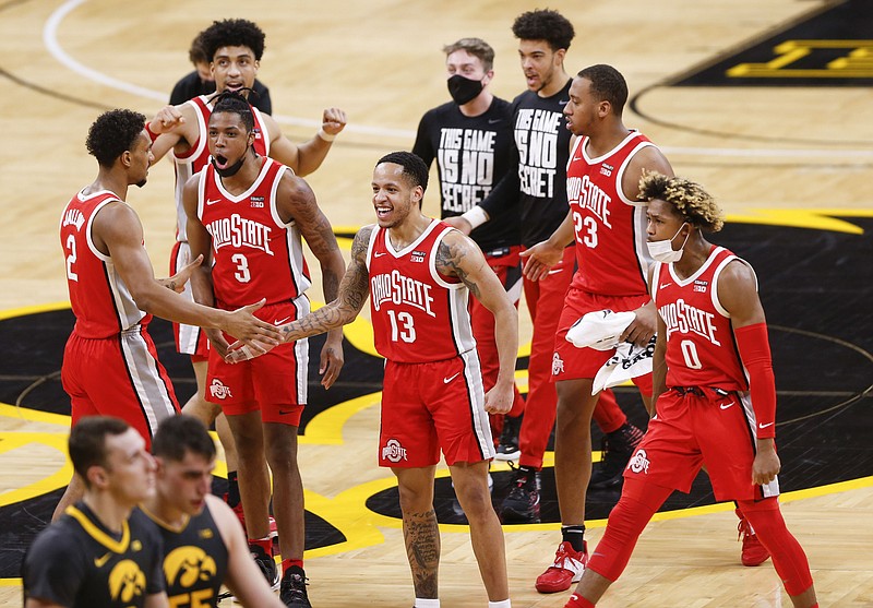 Ohio State players celebrate their win in an NCAA college basketball game against Iowa in Iowa City, Iowa, Thursday, Feb. 4, 2021. (Rebecca F. Miller/The Gazette via AP)