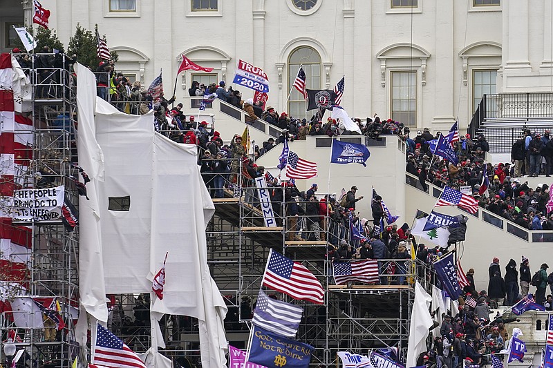 FILE - In this Jan. 6, 2021 file photo insurrectionists loyal to President Donald Trump riot outside the Capitol in Washington. (AP Photo/John Minchillo, File)