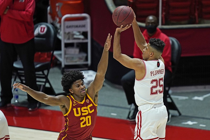 Utah guard Alfonso Plummer (25) shoots as Southern California guard Ethan Anderson (20) defends during the second half of an NCAA college basketball game Saturday, Feb. 27, 2021, in Salt Lake City. (AP Photo/Rick Bowmer)