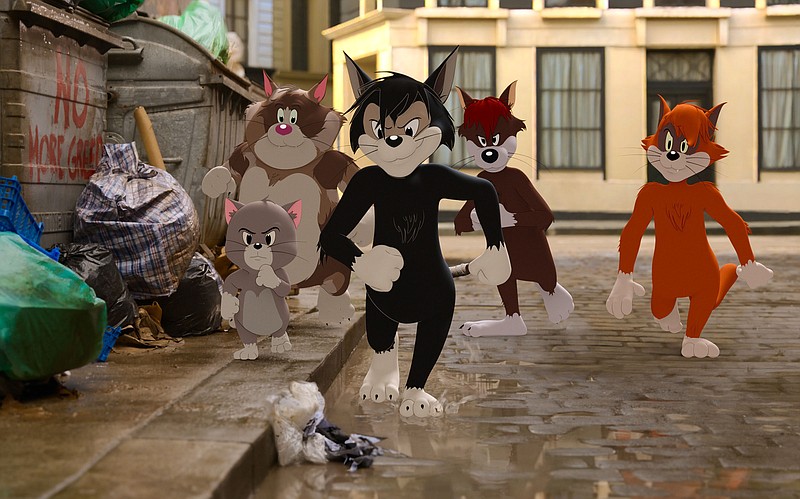 This image shows Butch, leader of the alley cats, foreground center, voiced by Nicky Jam, in a scene from the animated/live-action film "Tom & Jerry."  (Warner Bros. Pictures via AP)