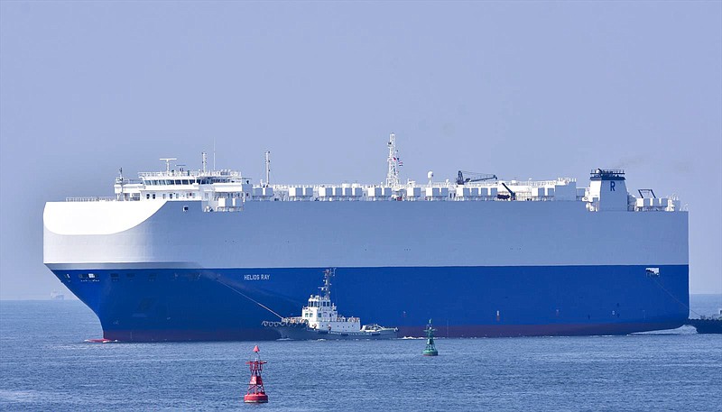 In this Aug. 14, 2020, photo, the vehicle cargo ship Helios Ray is seen at the Port of Chiba in Chiba, Japan. An explosion struck the Israeli-owned Helios Ray as it sailed out of the Middle East on Friday, Feb. 26, 2021, an unexplained blast renewing concerns about ship security in the region amid escalating tensions between the U.S. and Iran. (Katsumi Yamamoto via AP)
