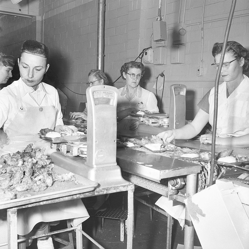 Workers assemble Swanson chicken TV dinners at the Campbell Soup plant in Fayetteville in 1956.

(Shiloh Museum of Ozark History/Northwest Arkansas Times Collection)