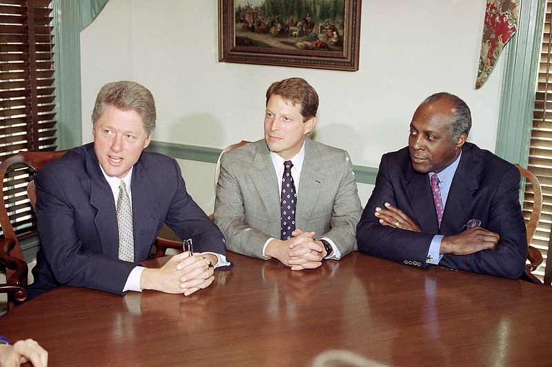 FILE - In this Nov. 18, 1993 file photo, President-Elect Bill Clinton, left, meets with Vice President-elect Al Gore, center, and Vernon Jordan at the Governor's Mansion in Little Rock, Ark.  Jordan, who rose from humble beginnings in the segregated South to become a champion of civil rights before reinventing himself as a Washington insider and corporate influencer, died Tuesday, March 2, 2021, according to a statement from his daughter. He was 85. (AP Photo/Greg Gibson, File)