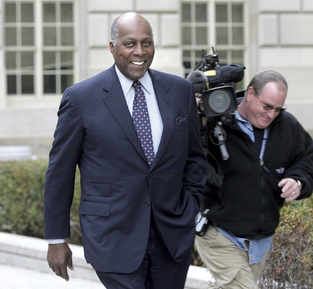FILE - In this Nov. 27, 2006 file photo, Vernon Jordan, a former adviser to President Clinton, walks outside the Woodrow Wilson Center in Washington. Jordan, who rose from humble beginnings in the segregated South to become a champion of civil rights before reinventing himself as a Washington insider and corporate influencer, died Tuesday, March 2, 2021, according to a statement from his daughter. He was 85. (AP Photo/Lawrence Jackson, File)