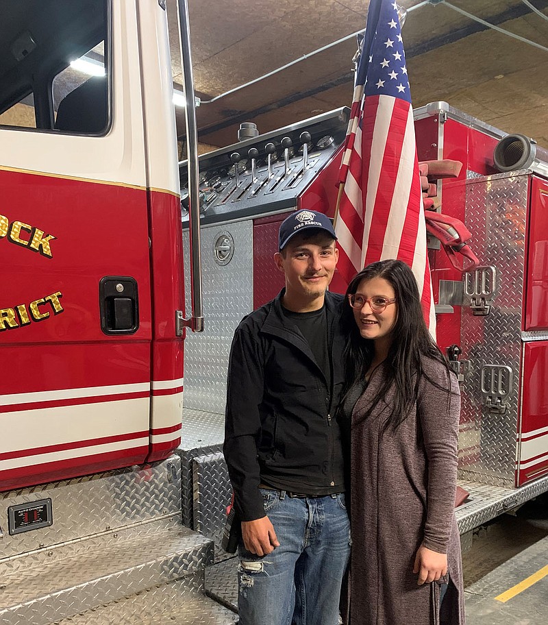 SALLY CARROLL/SPECIAL TO MCDONALD COUNTY PRESS
Malachi Logan, left, credits his wife, Jade, for her support while he volunteers at the White Rock Fire Department. The two, who first met in third grade, have a young family together. Logan is dedicated to helping serve his community.
