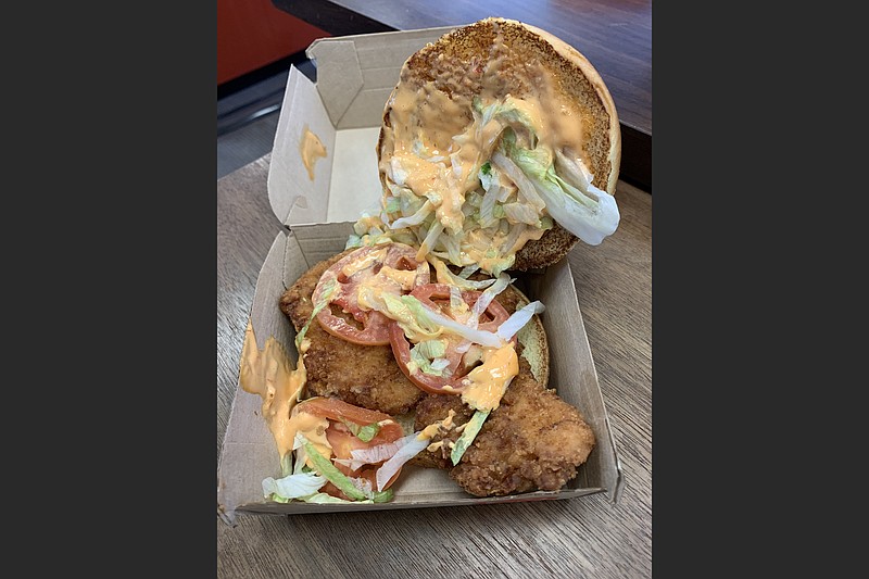 McDonald's Crispy Chicken Sandwich replaces the McChicken. A deluxe version of the sandwich adds shredded lettuce, Roma tomatoes and mayonnaise, or in this case, Spicy Pepper Sauce. (Special to the Democrat-Gazette)