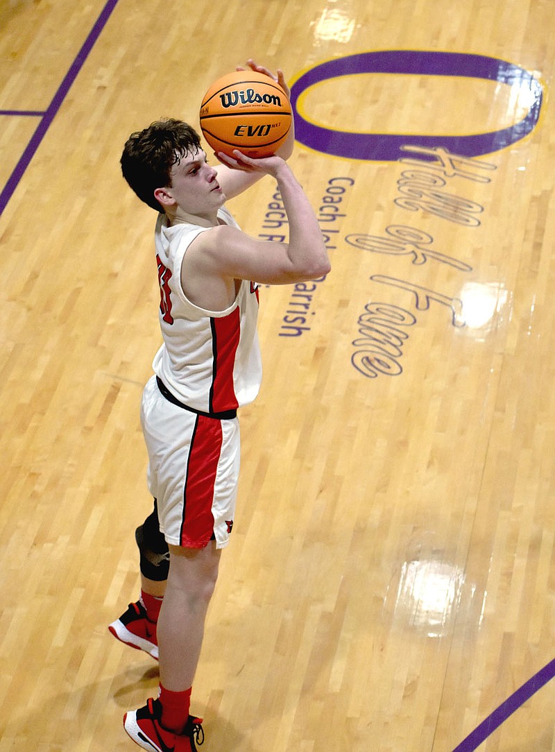 MARK HUMPHREY  ENTERPRISE-LEADER/Farmington freshman Layne Taylor shoots a 3-pointer during 4A North Regional action at Ozark last week. Taylor scored 15 points as the Cardinals defeated Subiaco Academy on Wednesday, March 3.