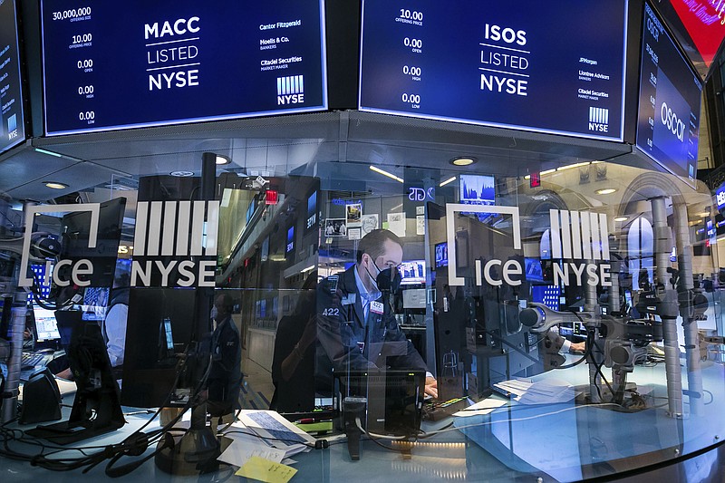 In this photo provided by the New York Stock Exchange, a trader works on the floor on Wednesday, March 3, 2021. Stocks were mostly lower in afternoon trading as another tick up in bond yields gave investors pause. (Courtney Crow/New York Stock Exchange via AP)