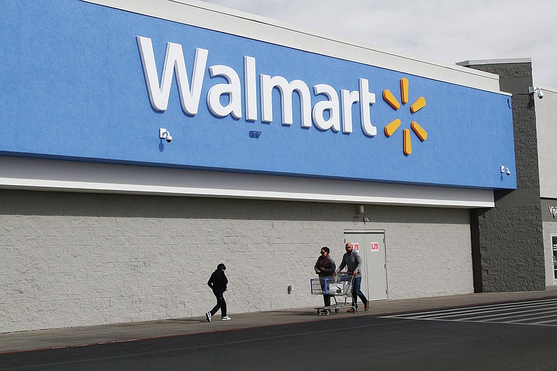 People shop at a Walmart Thursday, Feb. 6, 2020, in El Paso, Texas. The Justice Department is suing Walmart, alleging the company unlawfully dispensed controlled substances through its pharmacies, helping to fuel the opioid crisis in America, a person familiar with the matter told The Associated Press. The civil complaint being filed Tuesday, Dec. 22, 2020 points to the role Walmart’s pharmacies may have played in the crisis by filling opioid prescriptions and by unlawfully distributing controlled substances to the pharmacies during the height of the opioid crisis, the person said.