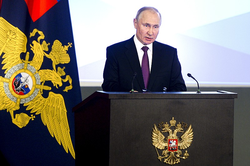 Russian President Vladimir Putin speaks to top Interior Ministry officials in Moscow, Russia, Wednesday, March 3, 2021. Putin urged the Interior Ministry to track down those who draw children to unsanctioned demonstrations. (Sputnik, Kremlin Pool Photo via AP)