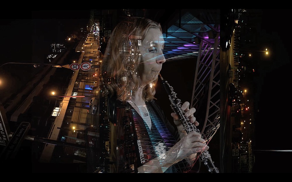 Videographer Darren Crisp superimposes Symphony of Northwest Arkansas principal oboist Theresa Delaplain on an image of Paris by artist Romain Erkiletlian for a multimedia performance Charles Gounod’s "Petite Symphonie," streaming April 2. (Special to the Democrat-Gazette)