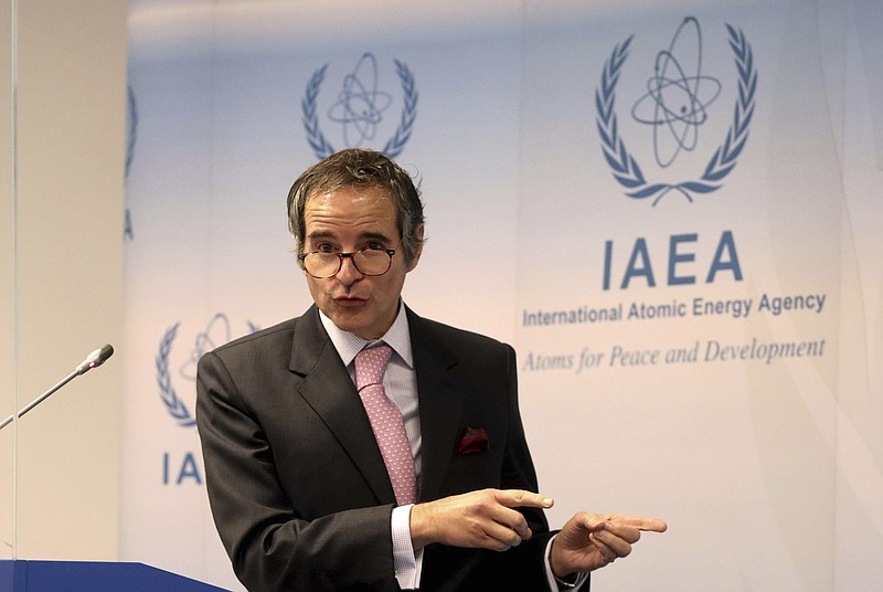 Director General of International Atomic Energy Agency, IAEA, Rafael Mariano Grossi from Argentina, addresses the media during a news conference behind plexiglass shields after a meeting of the IAEA board of governors at the International Center in Vienna, Austria, Monday, March 1, 2021. Due to restrictions related to COVID-19, it will be organised as a virtual meeting from the IAEA. (AP Photo/Ronald Zak)