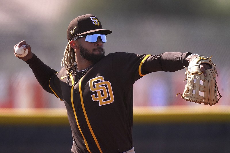 San Diego Padres' Fernando Tatis Jr. throws during a Feb. 23 spring training baseball practice in Peoria, Ariz. - Photo by Charlie Riedel of The Associated Press