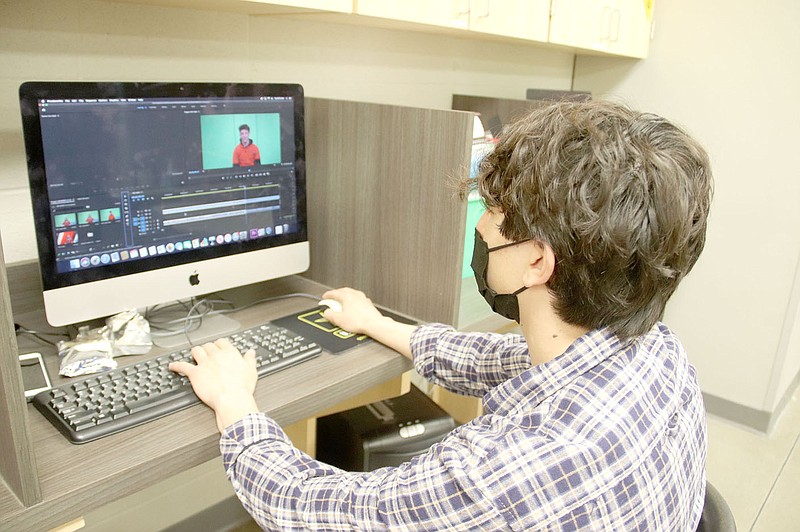 Gabriel Ruiz, a sophomore in Fundamentals of Broadcast Journalism at Farmington High School, is editing the class' Early Bird news show using Adobe Premiere Pro.