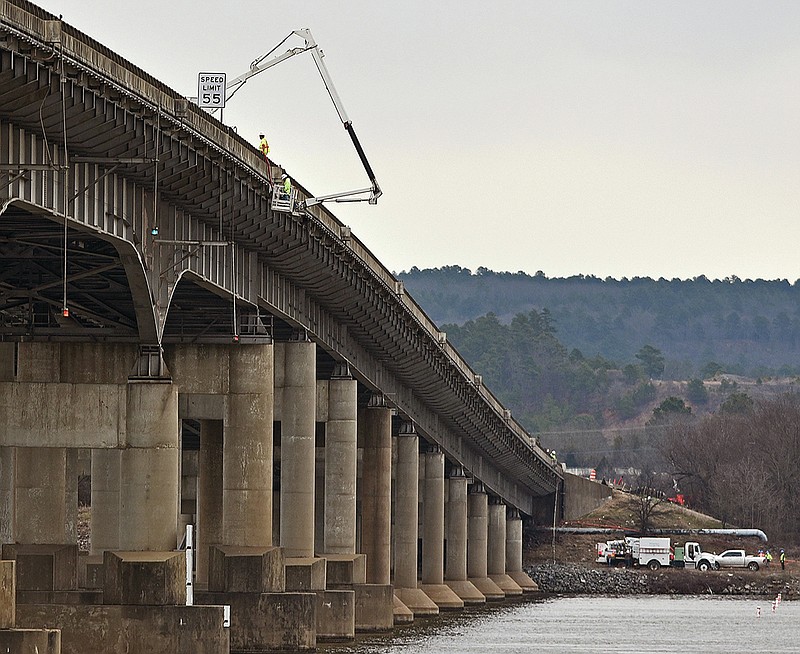 FILE — A crew inspects the side of the Interstate 430 bridge over the Arkansas River in this March 5, 2021 file photo. (Arkansas Democrat-Gazette/Staci Vandagriff)