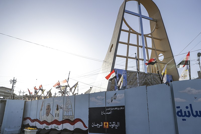 A mural depicting Pope Francis is seen in Baghdad, Iraq, Friday, March 5, 2021. Pope Francis has arrived in Iraq to urge the country's dwindling number of Christians to stay put and help rebuild the country after years of war and persecution, brushing aside the coronavirus pandemic and security concerns. (AP Photo/Andrew Medichini)