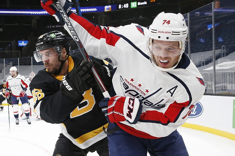 Washington Capitals' John Carlson (74) defends against Boston Bruins' David Krejci (46) during the second period of Friday's game in Boston. - Photo by Michael Dwyer of The Associated Press