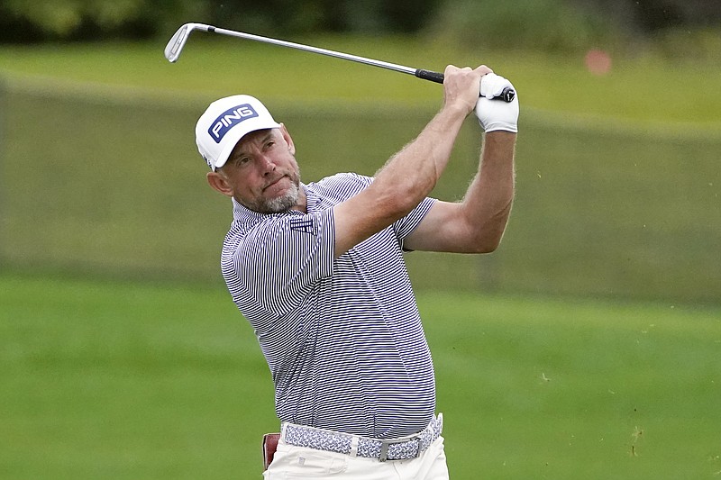 Lee Westwood, of England, hits a shot from the 16th fairway Saturday during the third round of the Arnold Palmer Invitational in Orlando, Fla. - Photo by John Raoux of The Associated Press