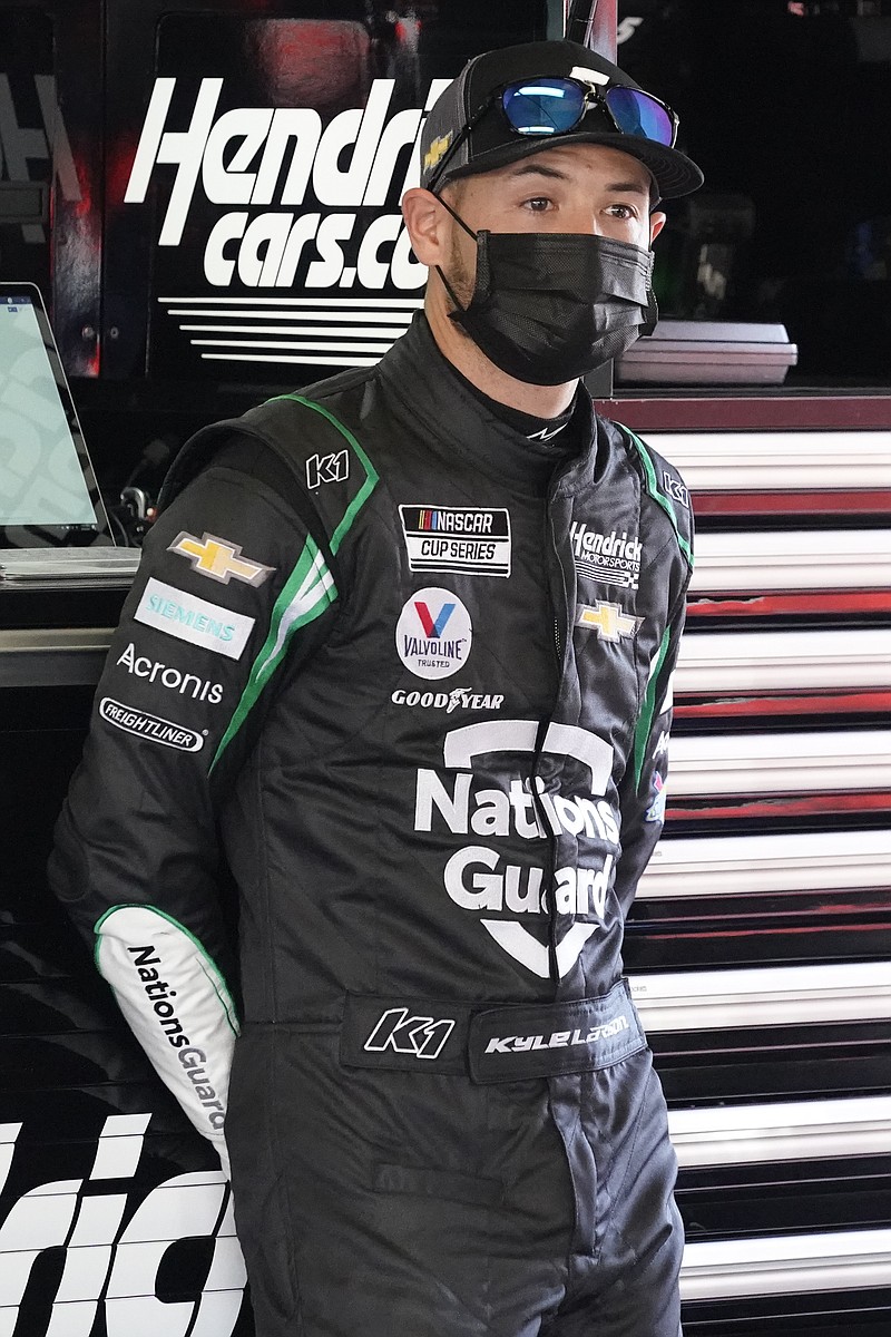 Kyle Larson stands in his garage during a Feb. 10 NASCAR Daytona 500 auto race practice session at Daytona International Speedway in Daytona Beach, Fla. - Photo by John Raoux of The Associated Press