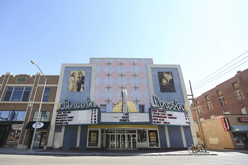 FILE - In this Sept. 4, 2020 file photo, the marquee at the Lincoln Theater announces upcoming shows for the newly renovated music venue in Cheyenne, Wyo.  Under a new proposal, a metro area would have to have at least 100,000 people to count as an MSA, double the 50,000-person threshold that has been in place for the past 70 years. Cities formerly designated as metros with core populations between 50,000 and 100,000 people would be changed to “micropolitan" statistical areas instead.(Cayla Nimmo/The Casper Star-Tribune via AP)