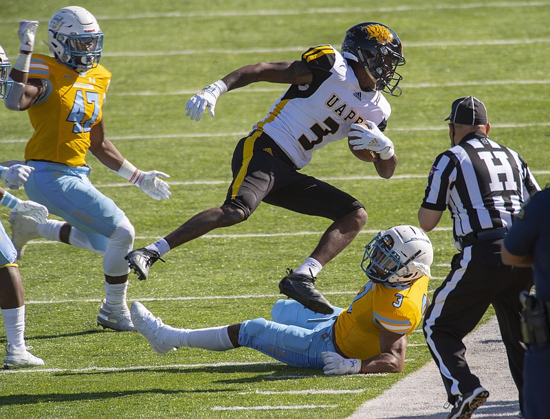 Southern University's Caleb Carter (47) and Tamaurice Smith (3) force Arkansas-Pine Bluff wide receiver Josh Wilkes (3), center, out of bounds after reception in the first half of the Jaguars' only scheduled home game of the spring season, Saturday, March 6, 2021 at A.W. Mumford Stadium. UAPB led 26-14 at the half. (The Advocate/Travis Spradling)