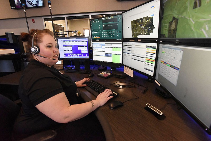 Desiree Beaver looks at information while on duty in the communications center at the Bentonville Police Department in this March 2, 2021 file photo. (NWA Democrat-Gazette/Flip Putthoff)