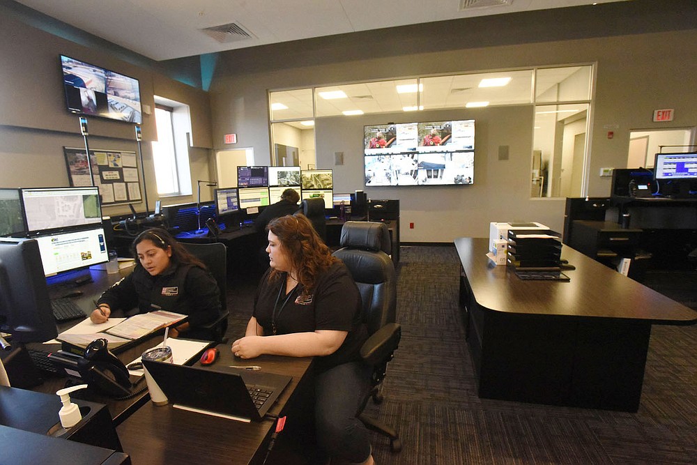 Amanda Aristondo (left) and Kiersten Hayes (both cq) go over data on Tuesday March 2 2021 while on duty at the Bentonville Police Department communications center. A new radio system for the department is part of a $266 million bond issue residents will vote on on April 13.
(NWA Democrat-Gazette/Flip Putthoff)