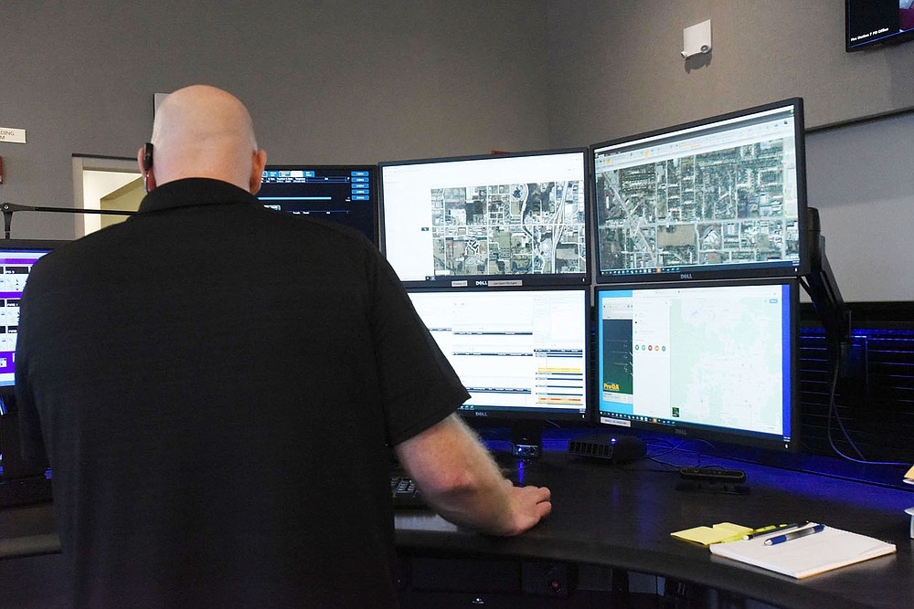 A dispatcher works Tuesday March 2 2021 in the communications center at the Bentonville Police Department.
(NWA Democrat-Gazette/Flip Putthoff)