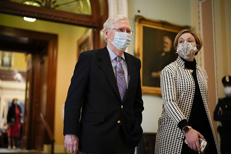 Senate Minority Leader Mitch McConnell of Ky., walks on Capitol Hill as the Senate works to complete the Democrats' $1.9 trillion COVID-19 relief bill, in Washington, Saturday, March 6, 2021. (AP Photo/J. Scott Applewhite)