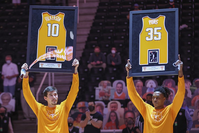 Tennessee forward John Fulkerson (10) and guard Yves Pons (35) are recognized on senior day before an NCAA college basketball game against Florida Sunday, March 7, 2021, in Knoxville, Tenn. (Randy Sartin/Pool Photo via AP)