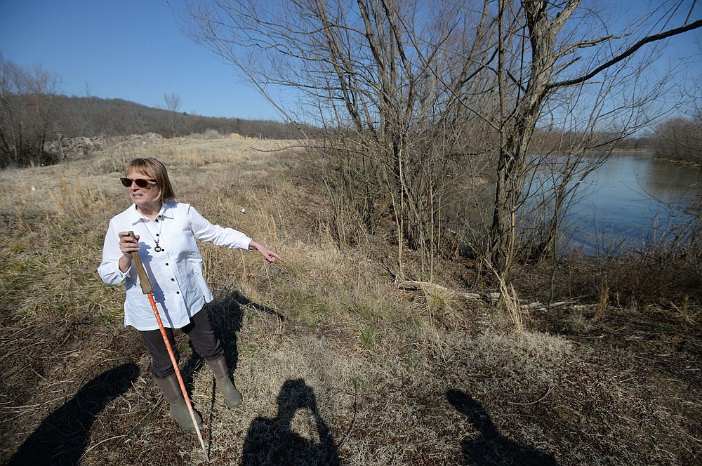 Sandi Formica, founder and executive director of Watershed Conservation Resource Center, leads a tour Thursday, March 4, 2021, of property the organization has purchased along with the city of Fayetteville, south of Huntsville Road near Dead Horse Mountain Road in Fayetteville. The Watershed Conservation Resource Center has a plan to restore the wetlands and wet prairie of the area and move its offices with a training center to the 98-acre site. Visit nwaonline.com/210307Daily/ for today's photo gallery.
(NWA Democrat-Gazette/Andy Shupe)