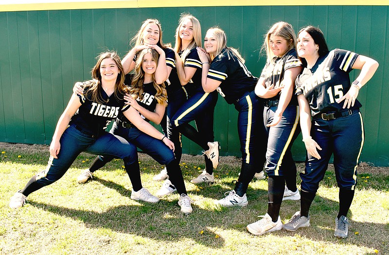 MARK HUMPHREY ENTERPRISE-LEADER/Senior members of Prairie Grove's 2021 Lady Tiger varsity softball team, who have since graduated (from left): Mackenzie Parnell, Sydney Stearman, Kelsey Pickett, Karaline McConnell, Maddie Hutchinson, Zoie Hornback and Anna Autrey goof off on Media Day.